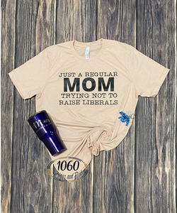 Just a regular mom trying not to raise liberals Tee